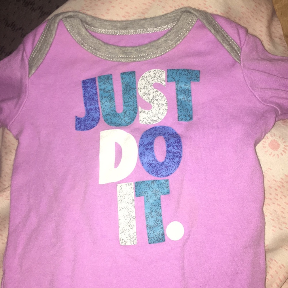Purple Nike Baby Onesie